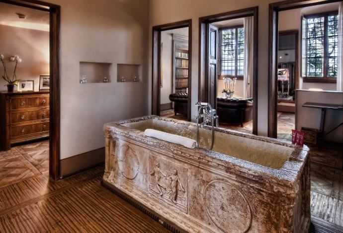 It doesn't have to be this extravagant (from the Affresco Suite at the hotel Il Salviatino in Florence, Italy) but stone baths are always beautiful.