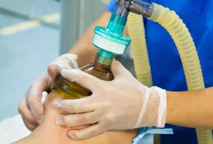 General anesthesia induces unconsciousness, which usually requires airway support.