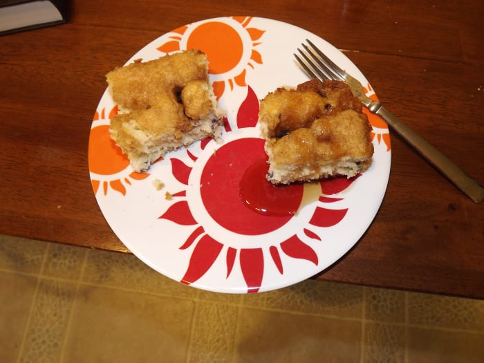 Two pieces of my finished blueberry coffee cake. The one on the right has syrup on it. Perfect for breakfast, also just as great without.