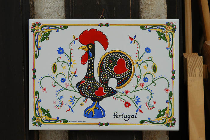 O galo de Barcelos, or "the Rooster of Barcelos" is the symbol of Portugal. It's a popular keepsake for tourists