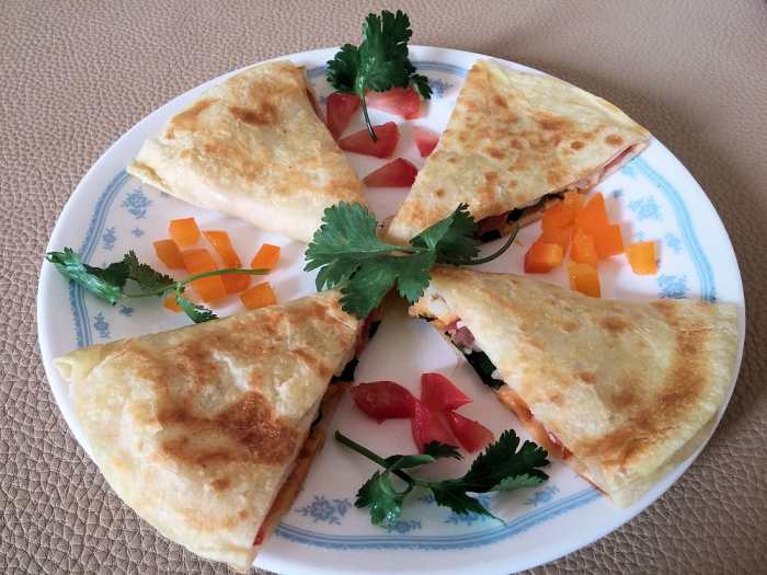 Use flour or corn tortillas, stuff them with whatever you like, and cook for 2 to 4 minutes in a quesadilla maker. Don't forget the cheese!