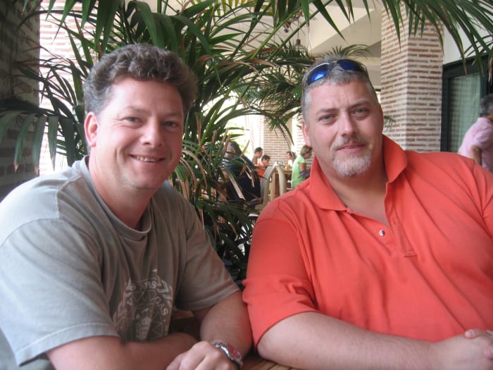 Prematurely going gray looks distinguished and sexy when not hidden by hair coloring. Here are my two brother's with their salt and pepper hair.