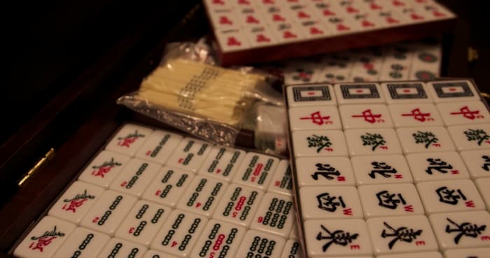 My majhong set, with point sticks, dice, four blank tiles, and a wind of the round die.