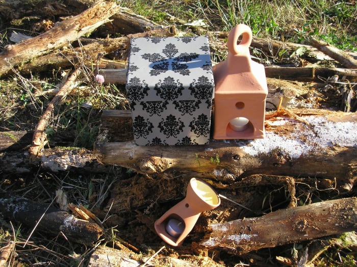 Terracotta lantern and oil burner that will be painted. The gift box I was given with a flower bulb inside so I will recycle and use it for another gift. The wood can be dried out and chopped up for firewood and given as a gift!