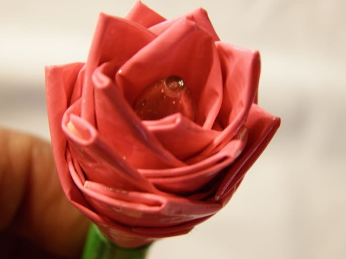 This one is made on a gel pen. You can use any pen or a straw for the stem. All you need is at least 16 inches of any color duct tape and scissors. You need about 6 inches of green duct tape for the stem.