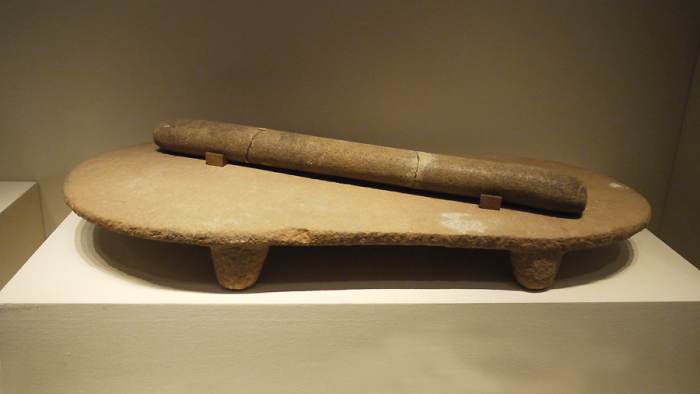 Stone quern and roller, Peiligang culture, 6100 B.C. to 5000 B.C., unearthed at Peiligang, Xinzheng, Henan Province, 1978.