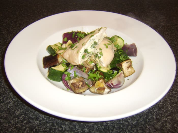 Chicken breast stuffed with feta cheese, porcini mushrooms, and spinach, served with roasted Mediterranean vegetables