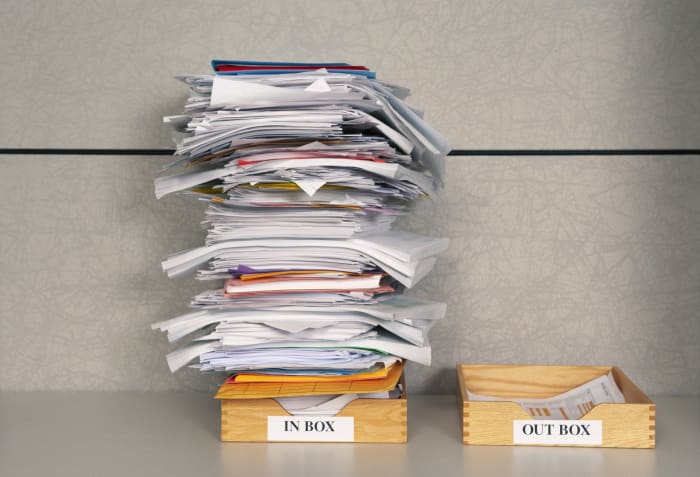 Wouldn't it be nice if your Inbox could look like the paper pile on the right, not the one on the left? Here's how to start sorting through your email.
