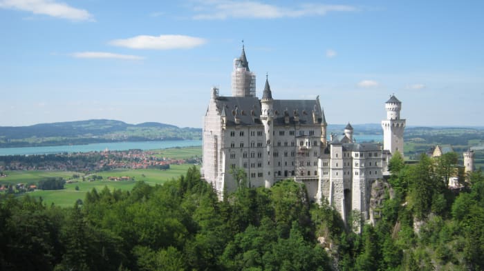 Neuschwanstein Castle is surrounded by beautiful countryside. This fairytale castle is said to have inspired Disney's logo.