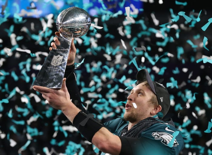 Feb 4, 2018; Minneapolis, MN, USA; Philadelphia Eagles quarterback Nick Foles (9) hoist the Vince Lombardi Trophy after a victory against the New England Patriots in Super Bowl LII at U.S. Bank Stadium.