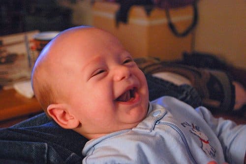 A baby laughs. But why? When do babies start laughing and what do they laugh for at such an early age?