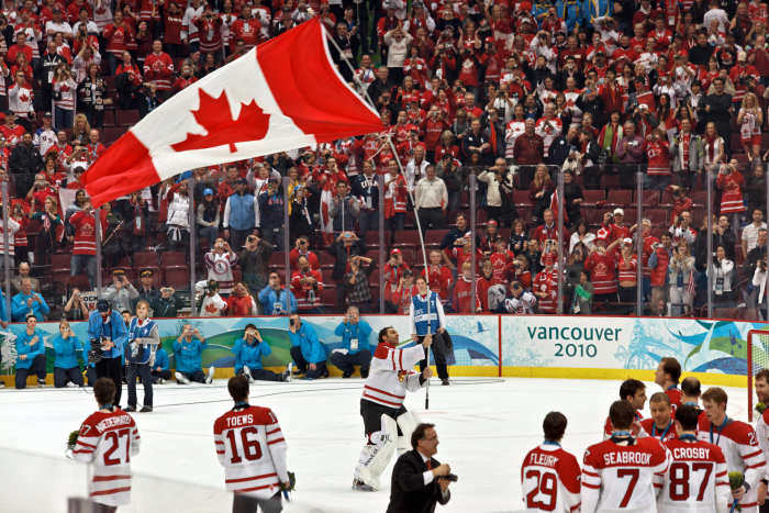 You don't have to be Canadian to be a hockey fan. Team and fans after Team Canada wins gold at the 2010 Olympics.