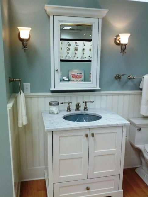 White wainscoting is another design technique that is coming back. Freestanding sinks are an option that is inexpensive but also takes up more space than a free floating sink.