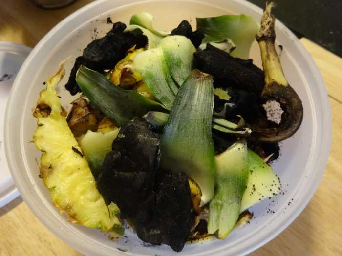Mixing in charcoal or ash with your compost will help disperse nutrients and balance out any acids added to the mix.