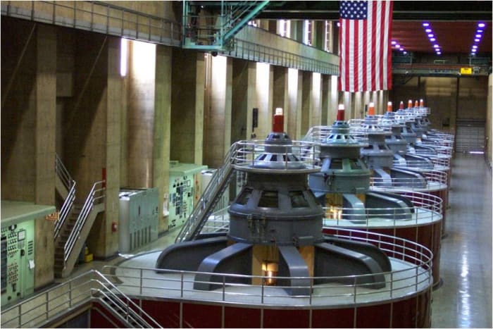 The Hoover Dam turns the rotors of these generators using water flowing from the dam. This generates power for many cities.