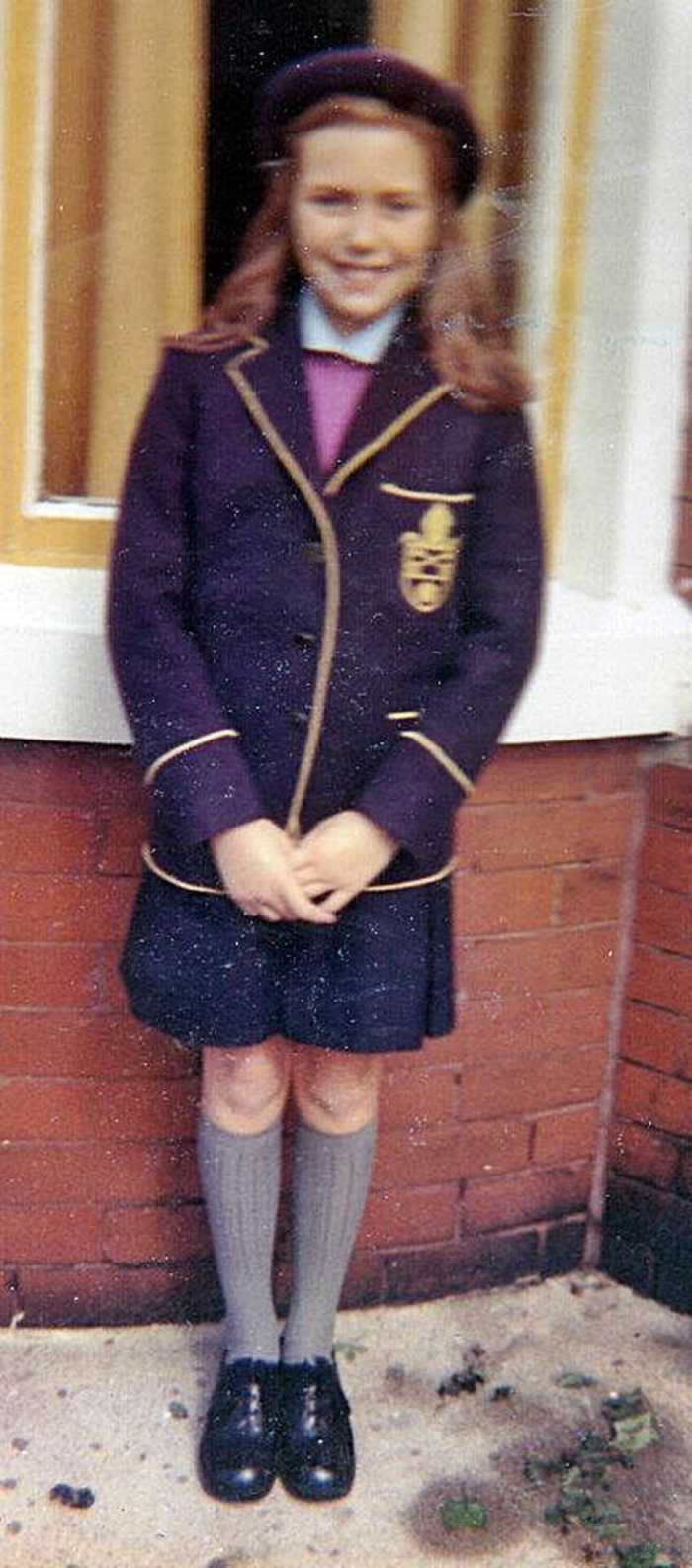 Shy child: Me at the age of eleven years, posing in my school uniform as I prepared to start secondary school - a private school for girls.