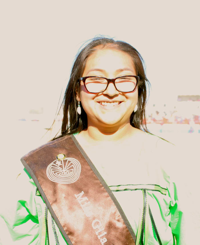 Tribal royalty, including this lovely attendant to Miss Gila River, offered a smile and handshake to visitors.