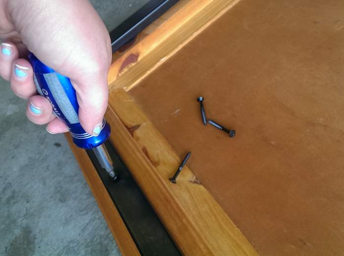 I was only staining my table top, so I took the metal frame off of it. make sure to put the screws in a plastic bag or safe place so you can reuse them at the end!