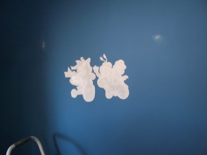 Here are the characters painted with white paint primer. You may need a small brush to get the fine, outer detail as we did.