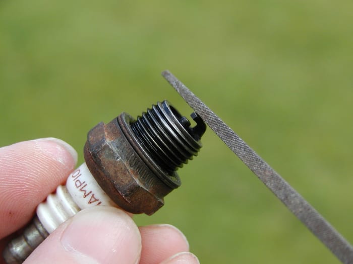 The outer electrode of the plug should be filed square if it is excessively rounded.