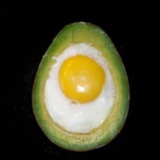 Avocado with cooked egg inside it. Moments later, this clever brunch tidbit was being stabbed with whole-grain toast.