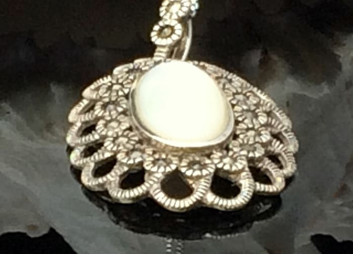 Circa 1920's sterling silver Chinese Export pendant set with mother of pearl and marcasites.