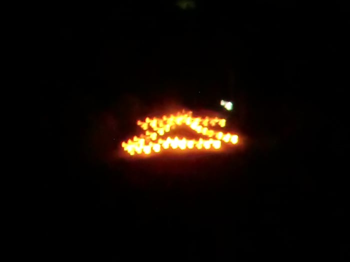 The kanji "dai-ichi" or "big one" burning atop of Satsuki Mountain seen from the Inagawa River