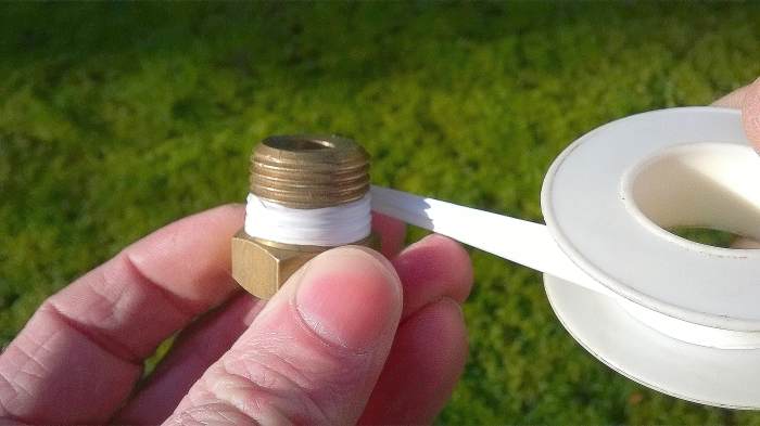 Wind the tape clockwise, neatly and tightly around the threads. Three layers should suffice. Overlap half the width of the thread as you wind.