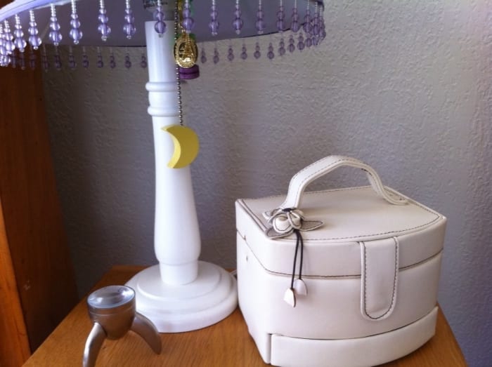 Feel free to use old keychains and cell phone charms as small adornments on handles and lamps. Just don't create a fire hazard!