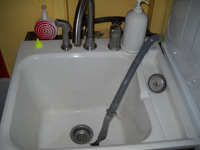 Laundry Sink: Use enzymes and lint catcher in washing machine sink drain.
