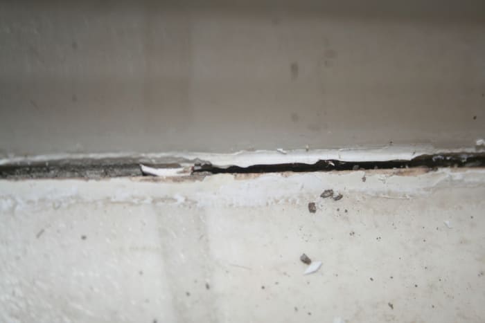 Post caulk removal tool. notice there is still some excess caulk. Using a caulk softener will lessen the amount of caulk that is left behind when using the removal tool.