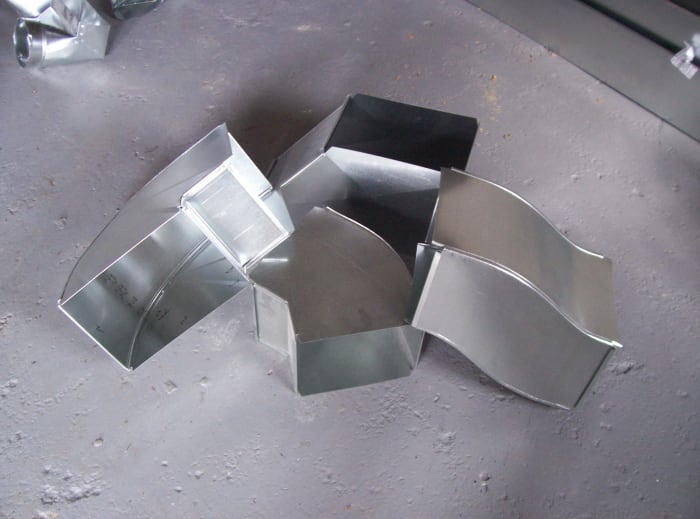 Photo #4 - Duct fittings (Duct 90 on left, duct 45 bottom center, transition top center, and riser on right) Just a few examples of duct fittings.