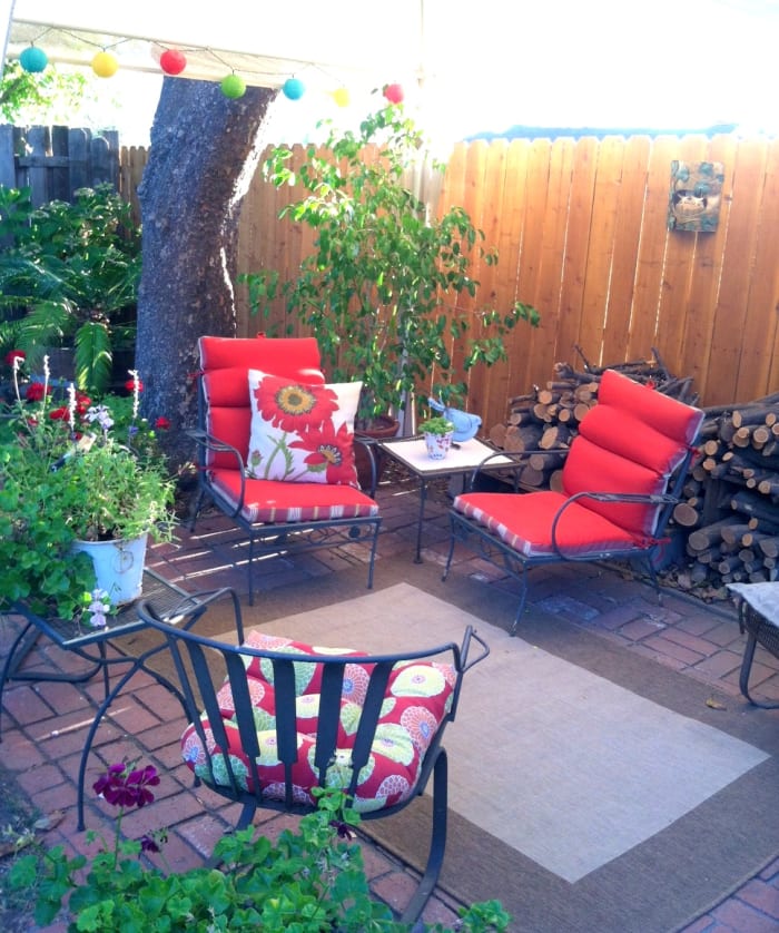 This simple seating area is set under a temporary gazebo and features battery-operated paper lanterns to add a magical ambience in the evening.