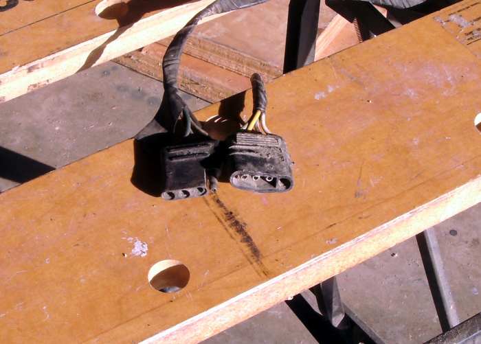 This plug and socket connector for trailer lights is a good candidate for the set of small wire brushes.