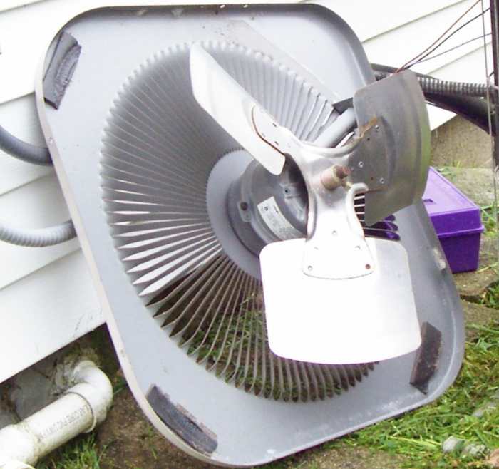 Here the condenser lid is removed so that you can see the fan and motor. Notice the solid housing on the motor. Be sure your fan spins freely with your hand and if not, lubricate the shaft so that it does.