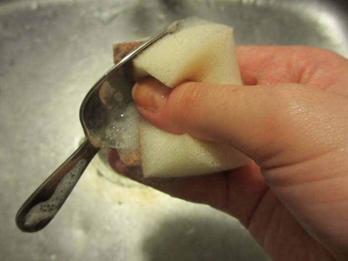 Wash your silver item with dish soap and warm water to remove any remaining baking soda residue.