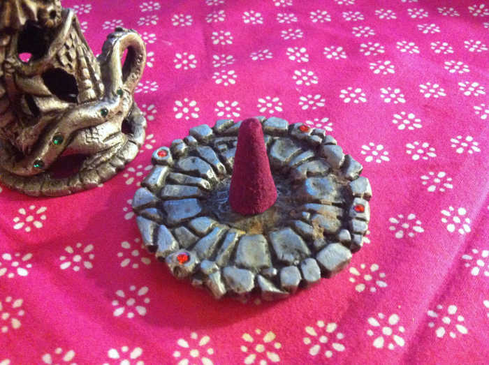 Cone burners have metal platforms to safely burn the incense and prevent accidental fires.