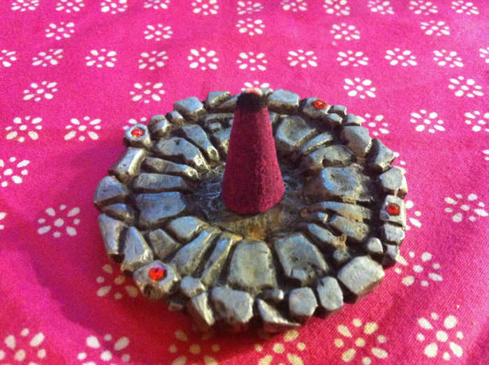 When burning correctly, cone incense should smolder at the tip before releasing smoke.