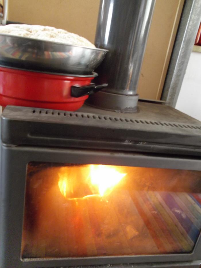 When you live off the grid, the top of a combustion stove is very useful. You can heat, warm or cook all kinds of things by raising them above the direct heat.