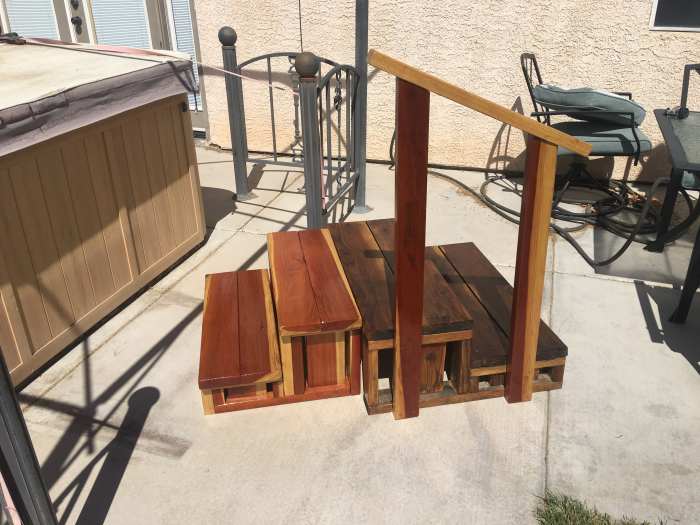 New steps and old back to back for comparison. Old steps will probably be painted soon to match exterior of hot tub. May seek a local buyer for the new steps.