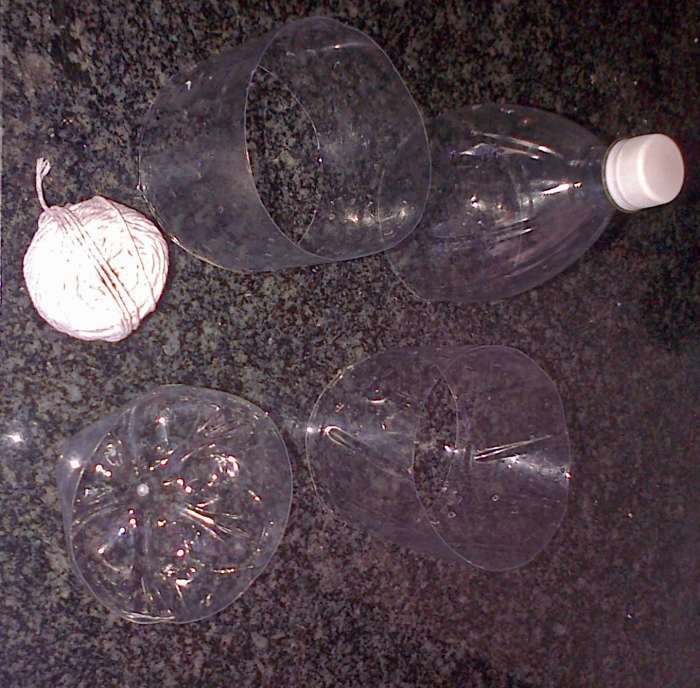 Cut the bottle into four pieces as shown. The top of the bottle can be used as a cloche for seedlings needing extra warmth. The bottom can be used to pour in beer as snail bait