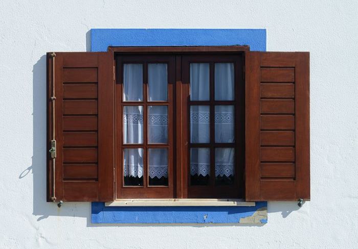 Window of traditional design in Porto Covo, Portugal