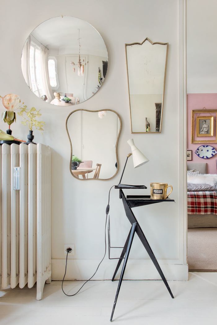 The mirrors reflect the whole space, making it appear larger, while bringing more natural light into the room.