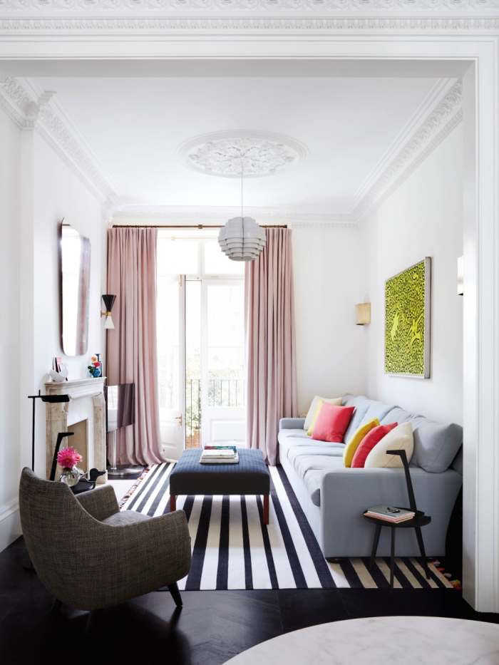 Placing the curtain rod right below the ceiling and hanging curtains that go all the way to the floor makes the ceilings appear higher.