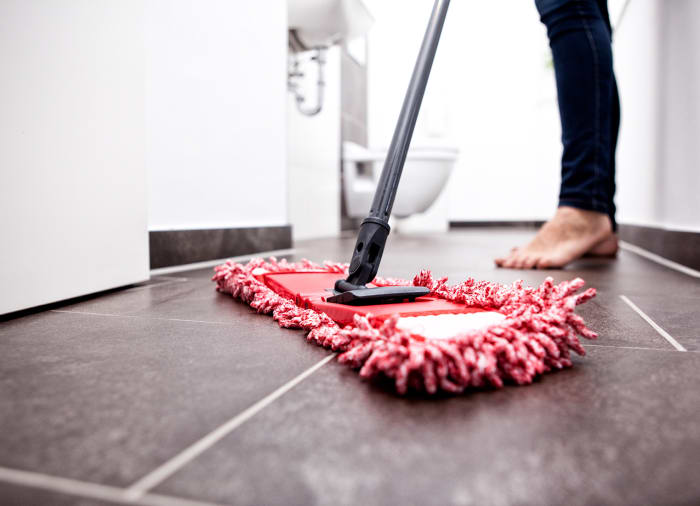 If your tiles have a film of soap residue go over it with a slightly damp microfiber mop to remove the haze.