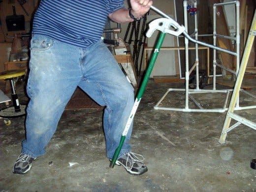 Bending the second offset bend. Not the foot and leg position, holding the bender handle firmly in place.