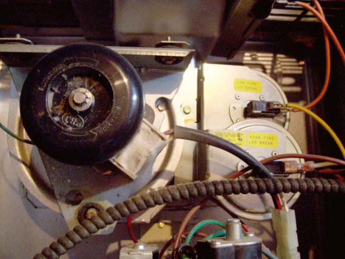 This unit has two pressure switches because it is a two-stage furnace. Inside the casing is a diaphragm, that when pressurized, completes the connection to the next component.