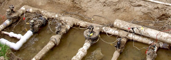 One of these valves sprang a leak and needed to be replaced. You can see the wiring that hooks each valve to its station timer on the controller (located out of view).