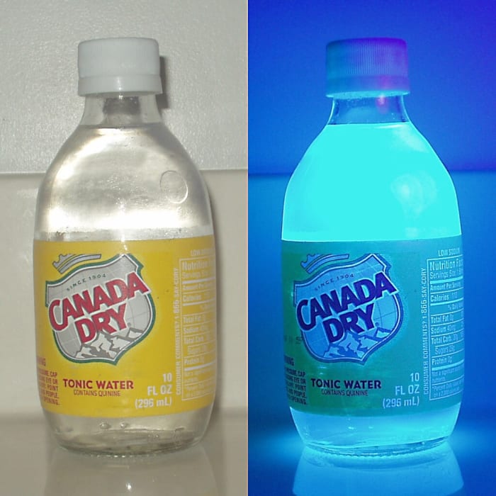Tonic water contains quinine. When ultraviolet light is shone on quinine, it fluoresces, releasing a blue light.