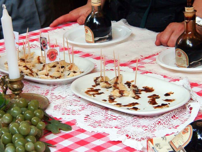 Parmesan cheese contains butyric acid. In Europe, parmesan cheese is another name for Parmigiano-Reggiano cheese.